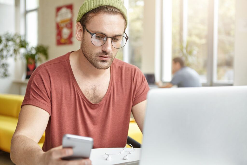 young person learning about money on a laptop